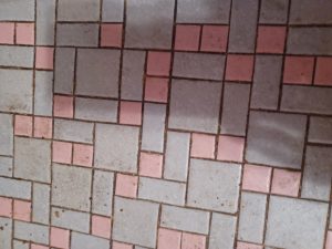 The floor, wall tiles, sink, tub and toilet are all pink