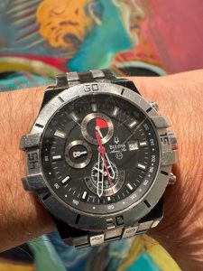 Here’s my “everyday” watch, which I’ve worn since July 14, 2010, or thereabouts. I tried to find an interesting background.